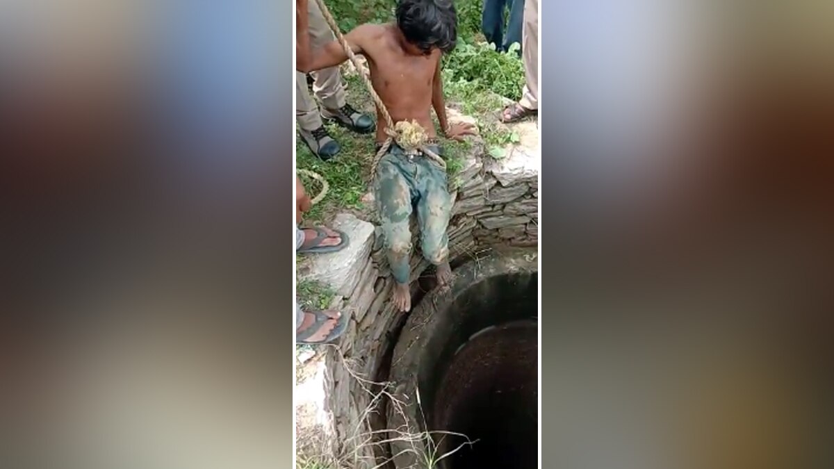 कुएं से निकलता युवक.