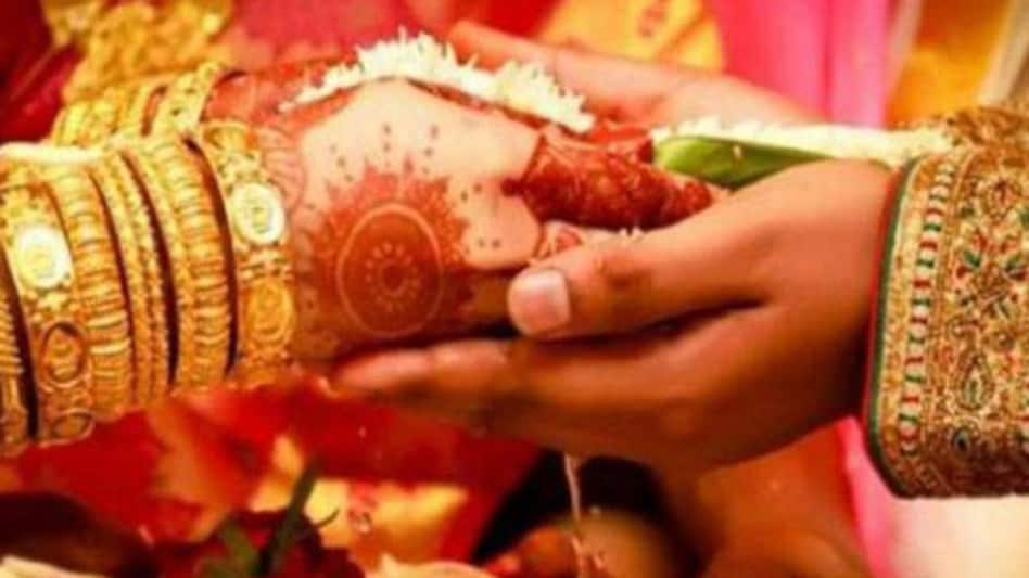 bride sister kissing groom on stage 