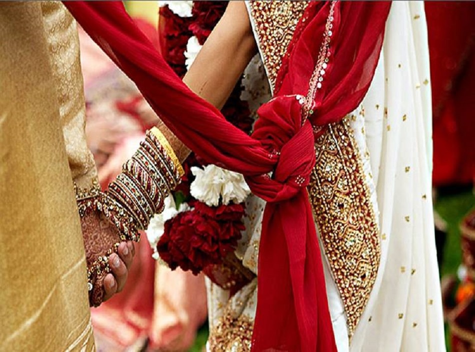 bride sister kissing groom on stage 