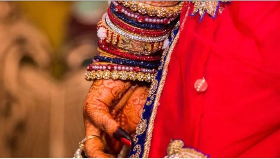 bride sister kissing groom on stage 