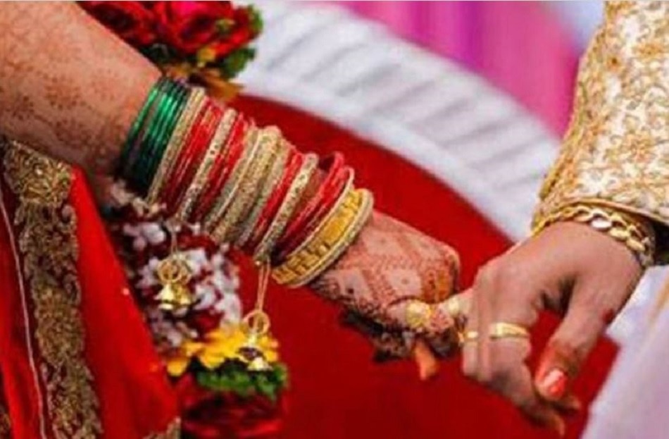 bride sister kissing groom on stage 