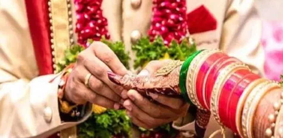 bride sister kissing groom on stage 