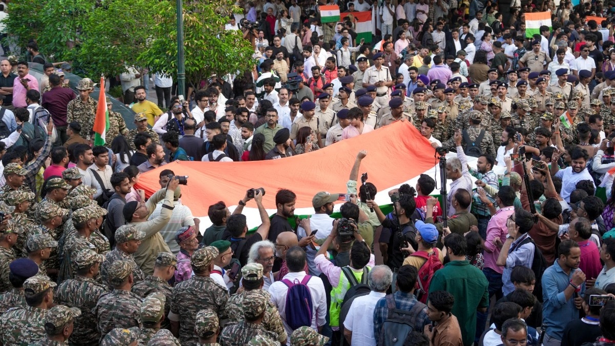 Delhi Police detain protesters during the Tiranga March
