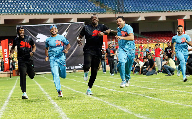 क्रिकेट में बोल्ट ने दिया युवी को 'झटका' तो 100 मीटर में जीते युवराज