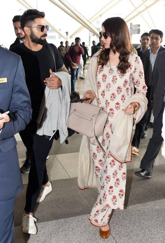 रिसेप्शन के बाद मुंबई पहुंचे विराट और अनुष्का, देखें PHOTOS