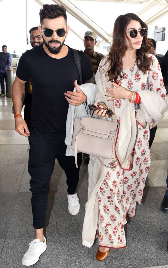 रिसेप्शन के बाद मुंबई पहुंचे विराट और अनुष्का, देखें PHOTOS