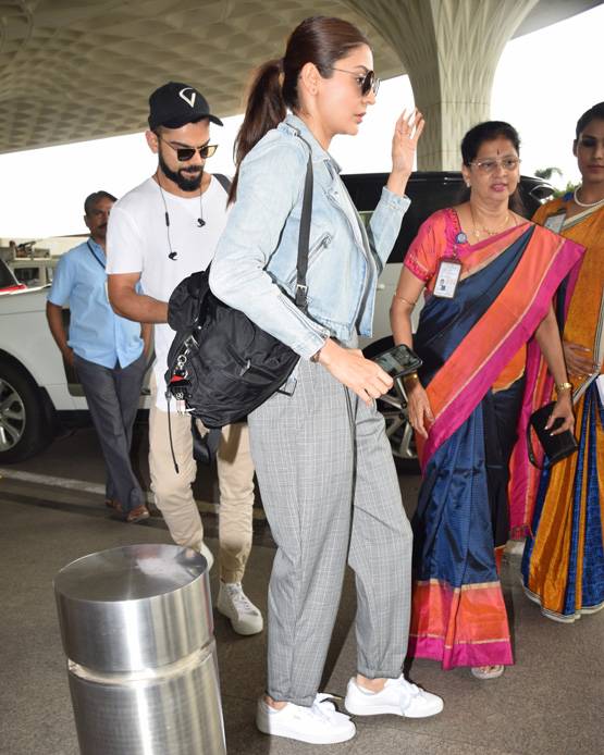 पत‍ि विराट कोहली के साथ एयरपोर्ट पर स्पॉट हुईं अनुष्का, PHOTOS