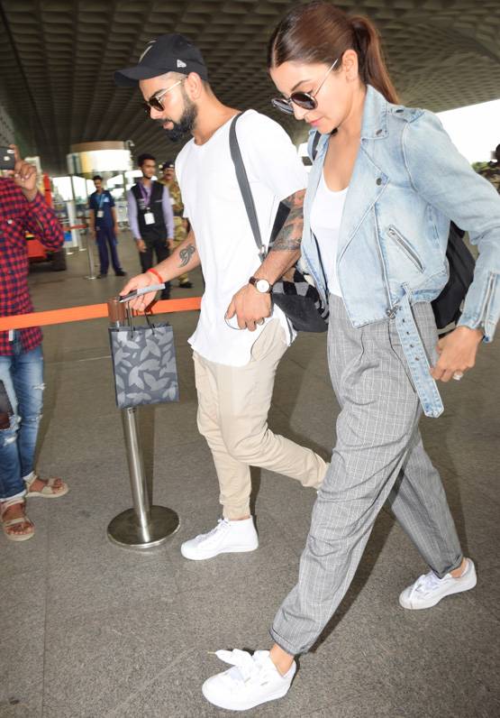 पत‍ि विराट कोहली के साथ एयरपोर्ट पर स्पॉट हुईं अनुष्का, PHOTOS