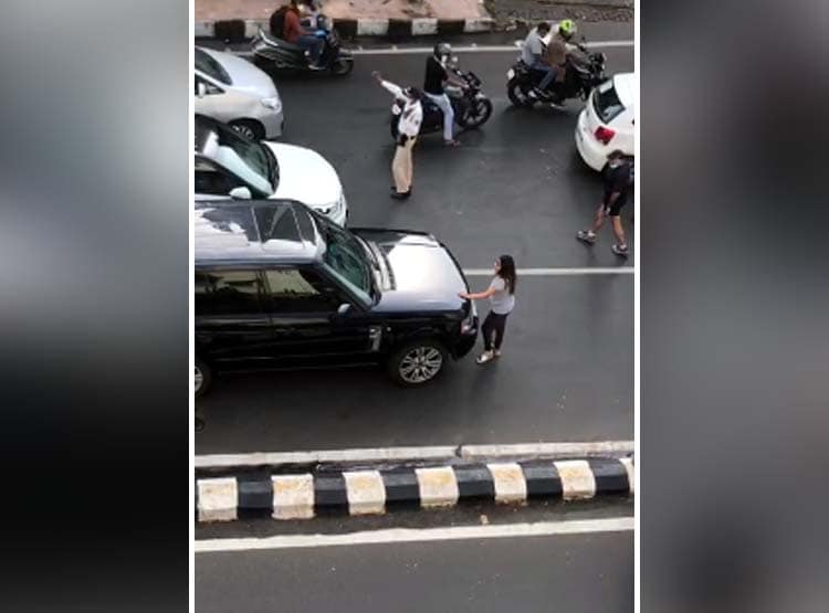 दूसरी महिला के साथ कार में था पति, बोनट पर चढ़ पत्नी ने किया हंगामा