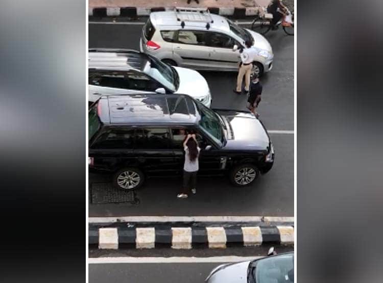 दूसरी महिला के साथ कार में था पति, बोनट पर चढ़ पत्नी ने किया हंगामा