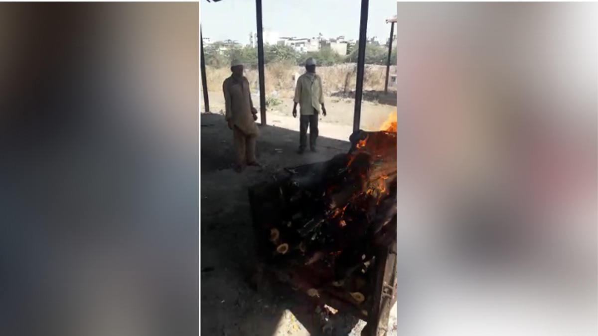 Muslims engaged in funeral