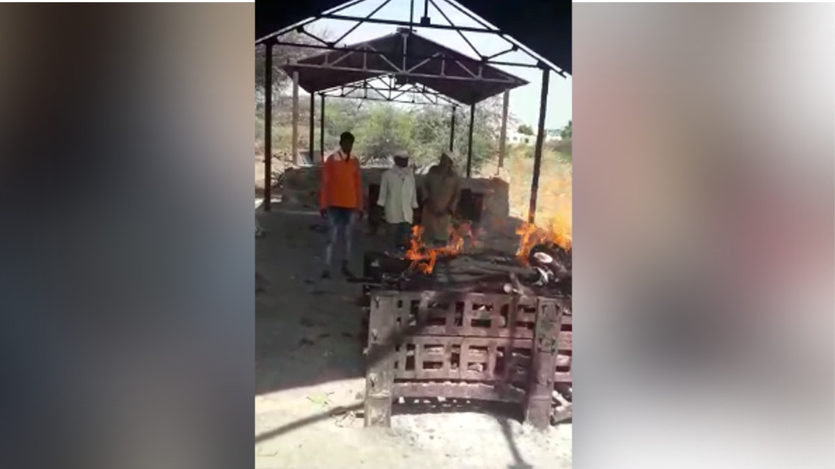Muslims engaged in funeral