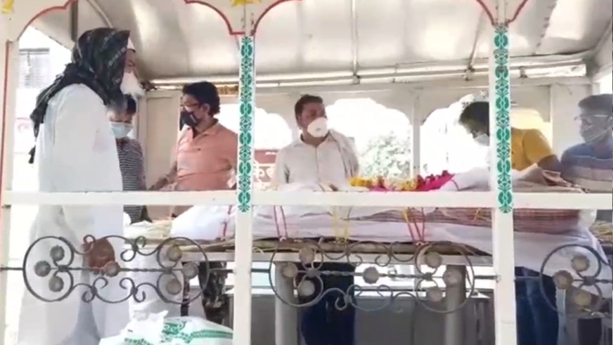 Muslims engaged in funeral