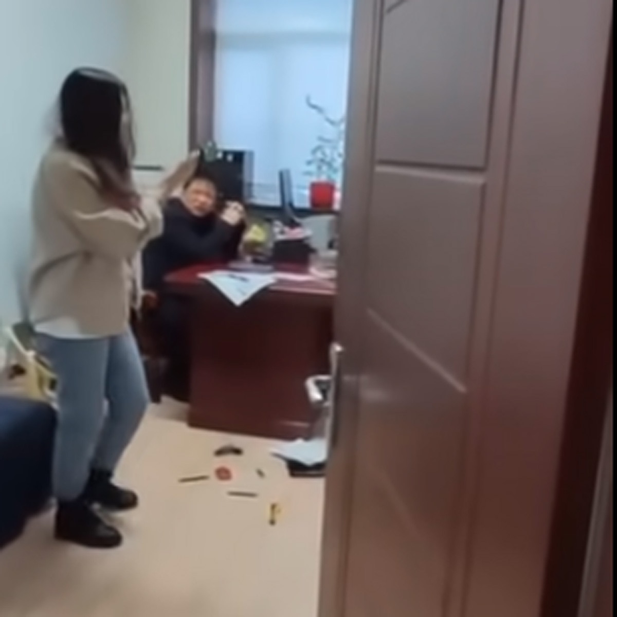 Woman beat boss