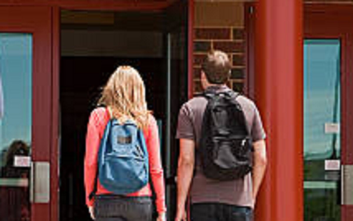 couple infront of school