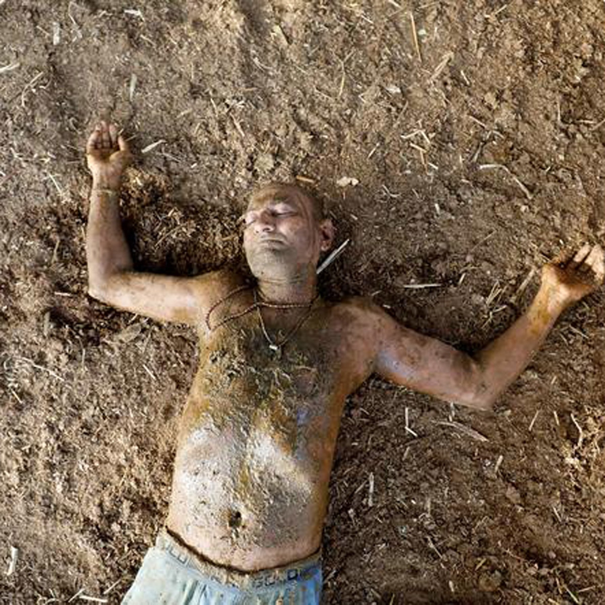 Indians putting cow dung