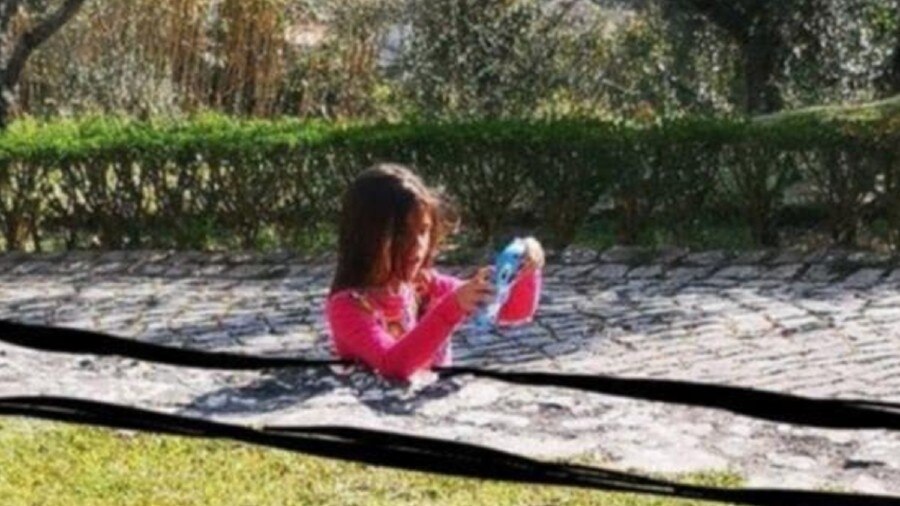 girl sunk in concrete road