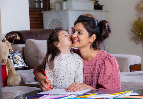woman kiss her daughter