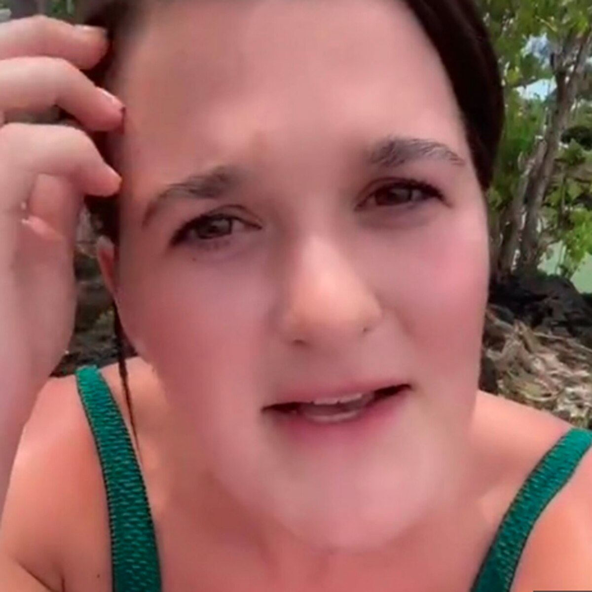 woman taking sunbath on beach