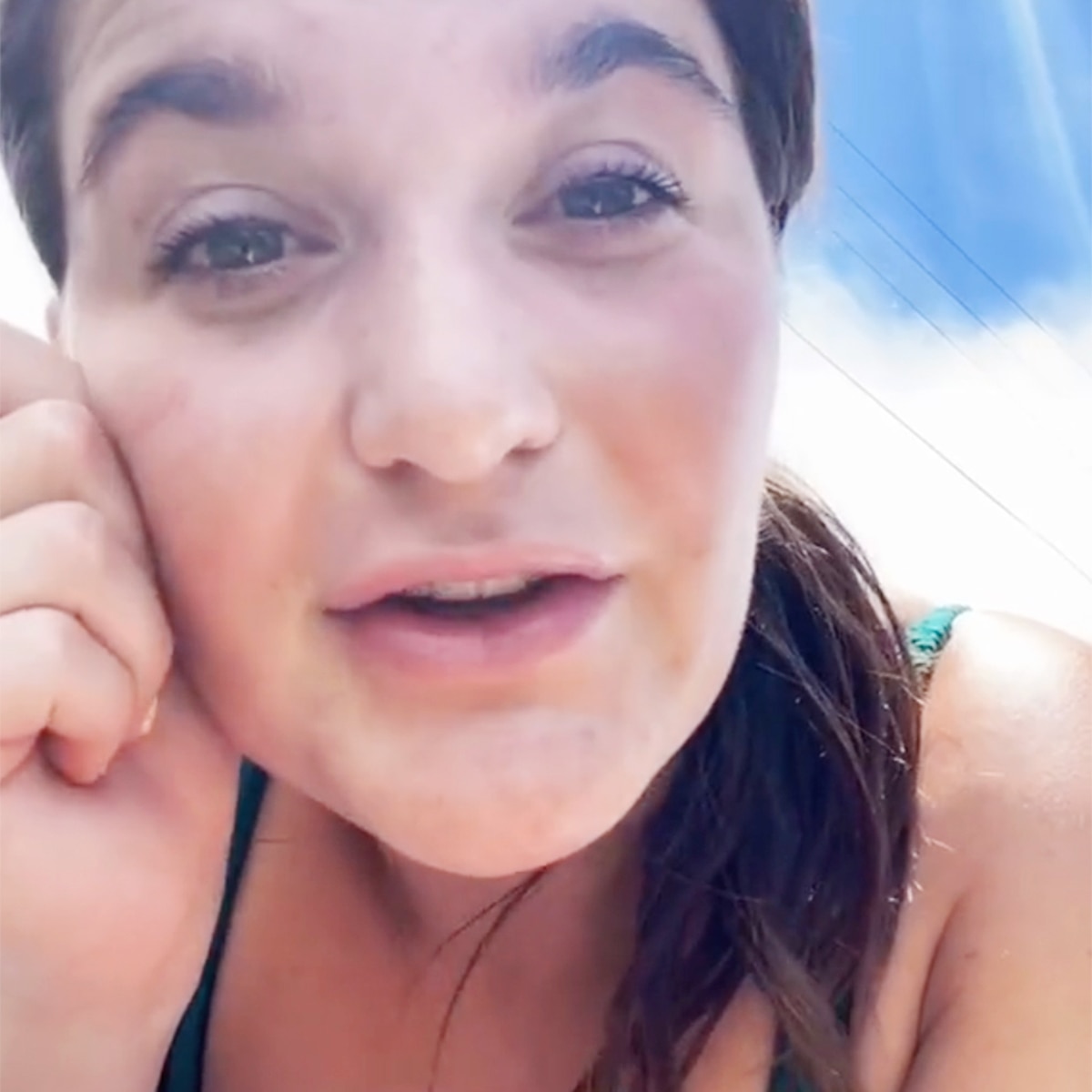 woman taking sunbath on beach