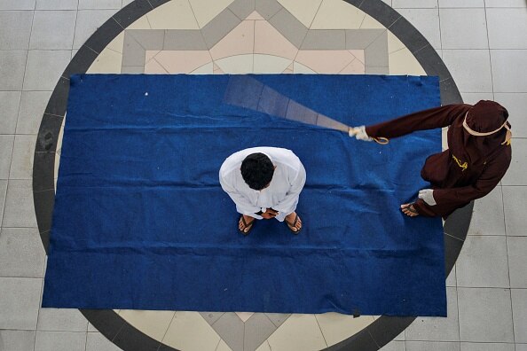 indonesian woman got hundred cane 