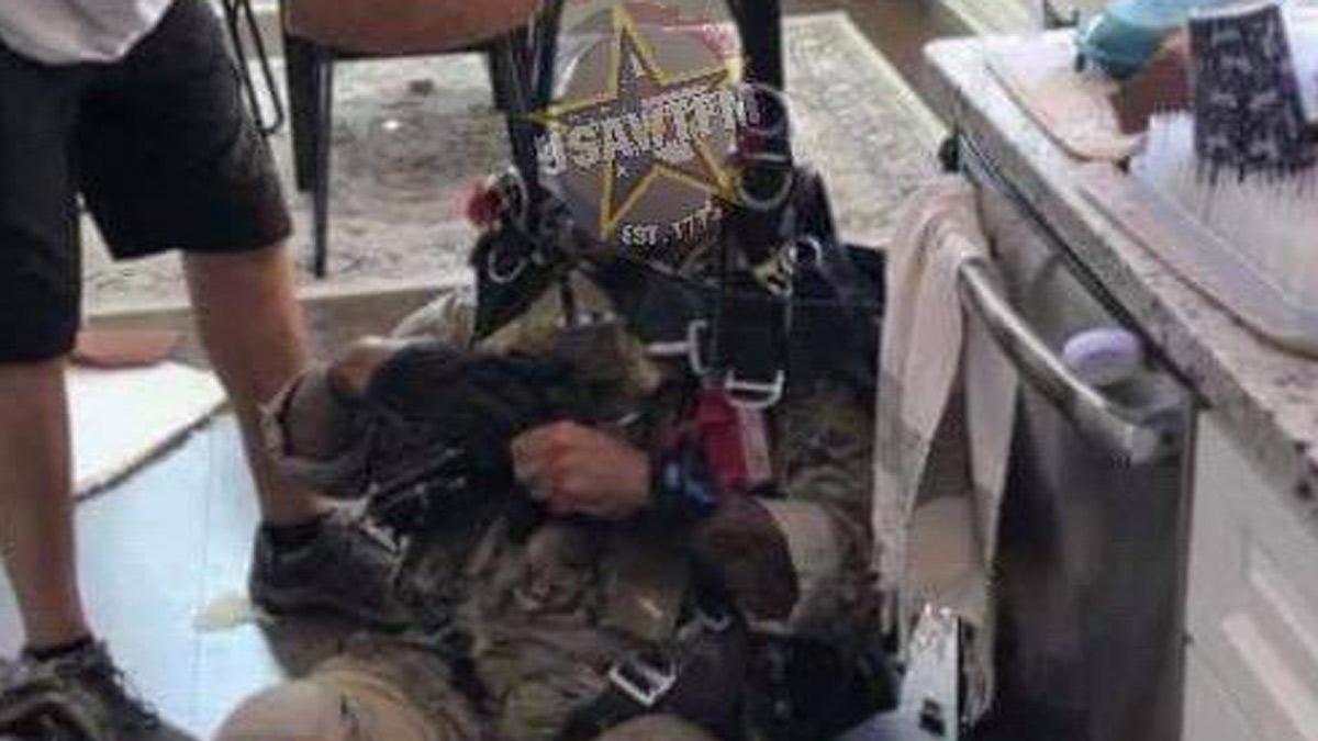 Parachuter plunges through roof