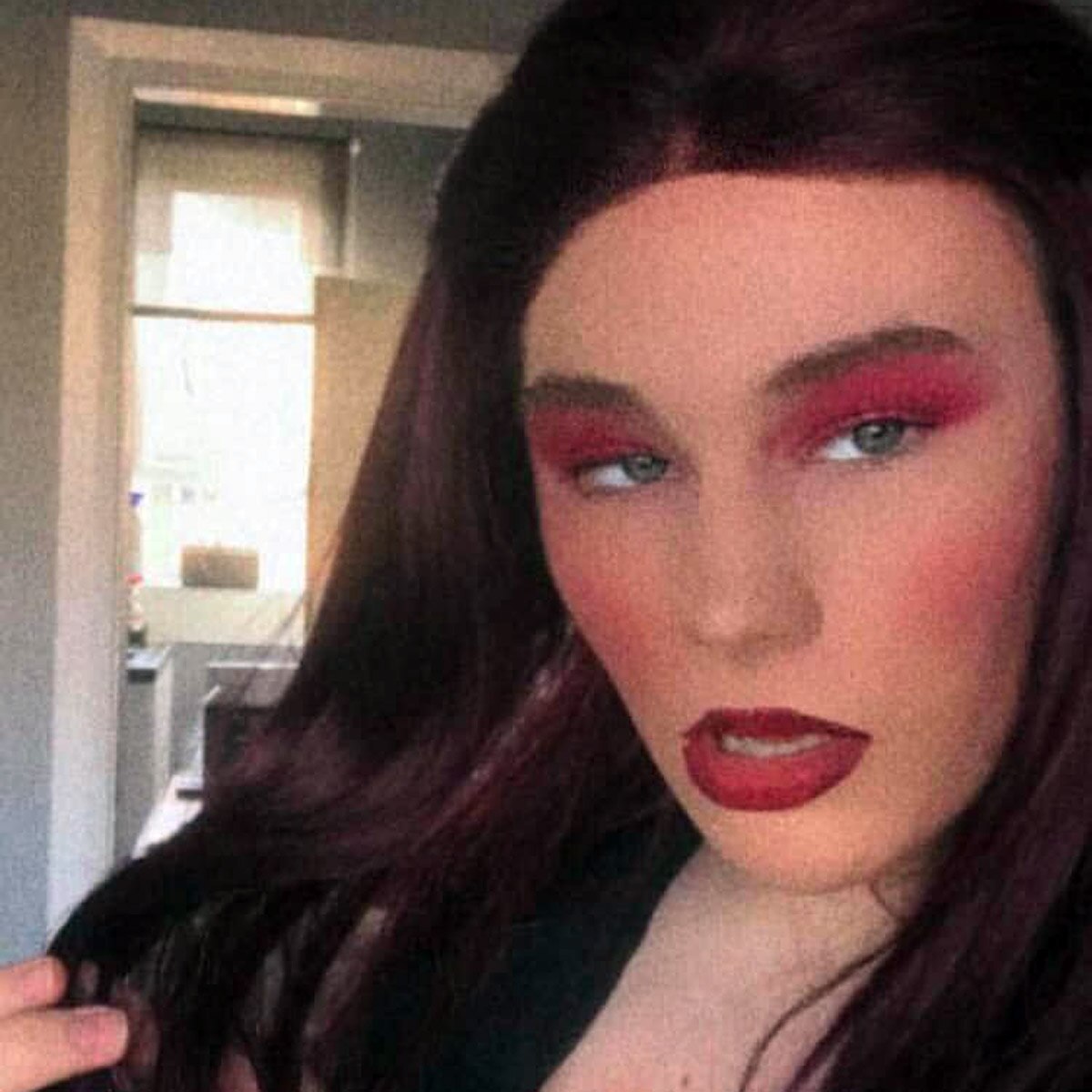 16 year old boy wearing mother clothes