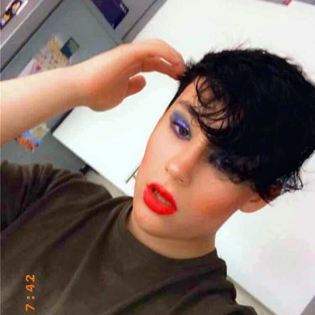 16 year old boy wearing mother clothes