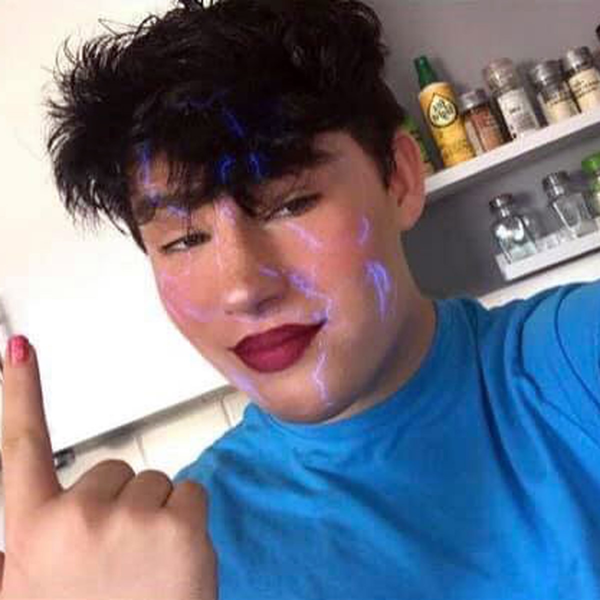 16 year old boy wearing mother clothes