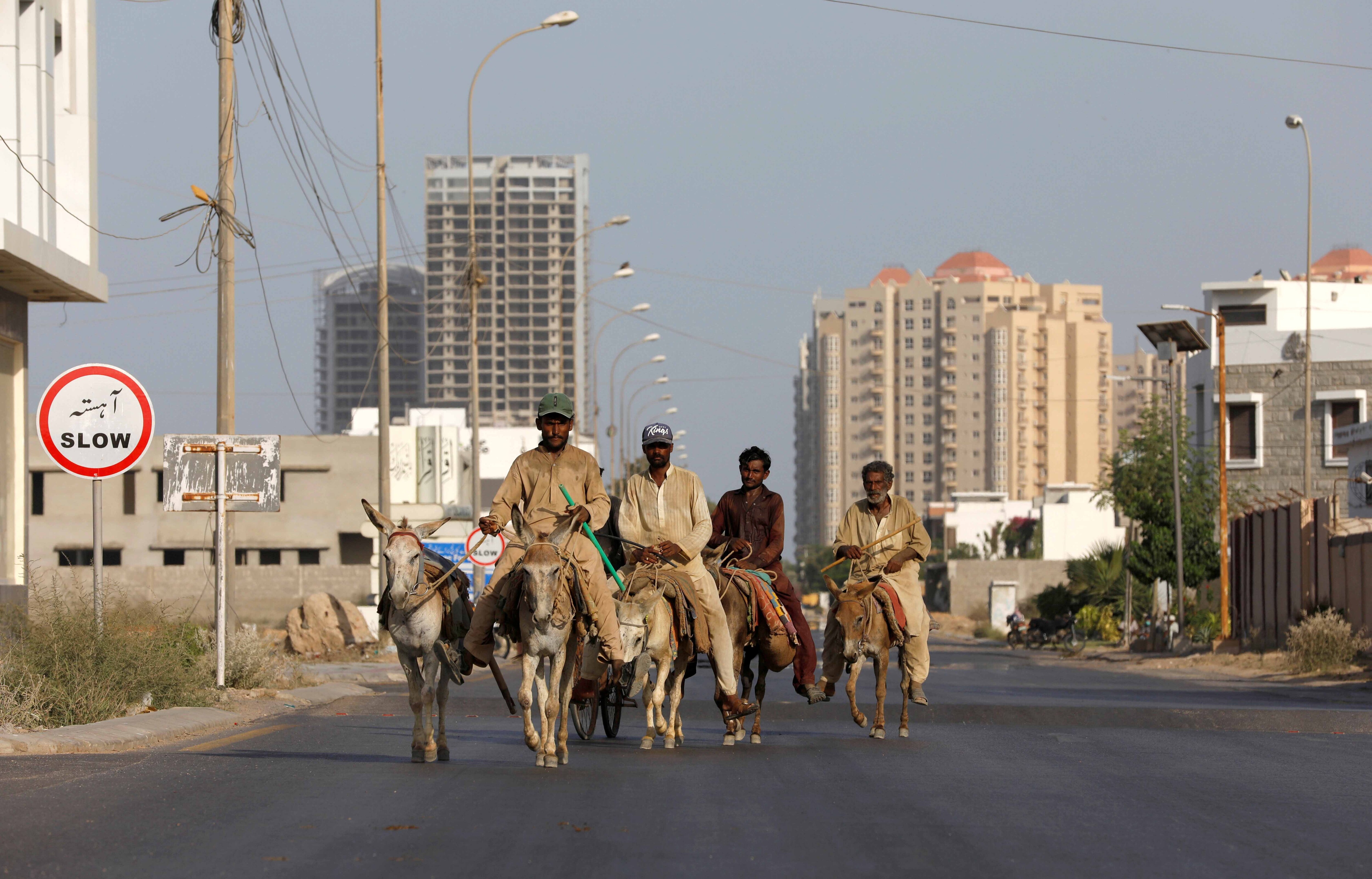 Men riding donkeys