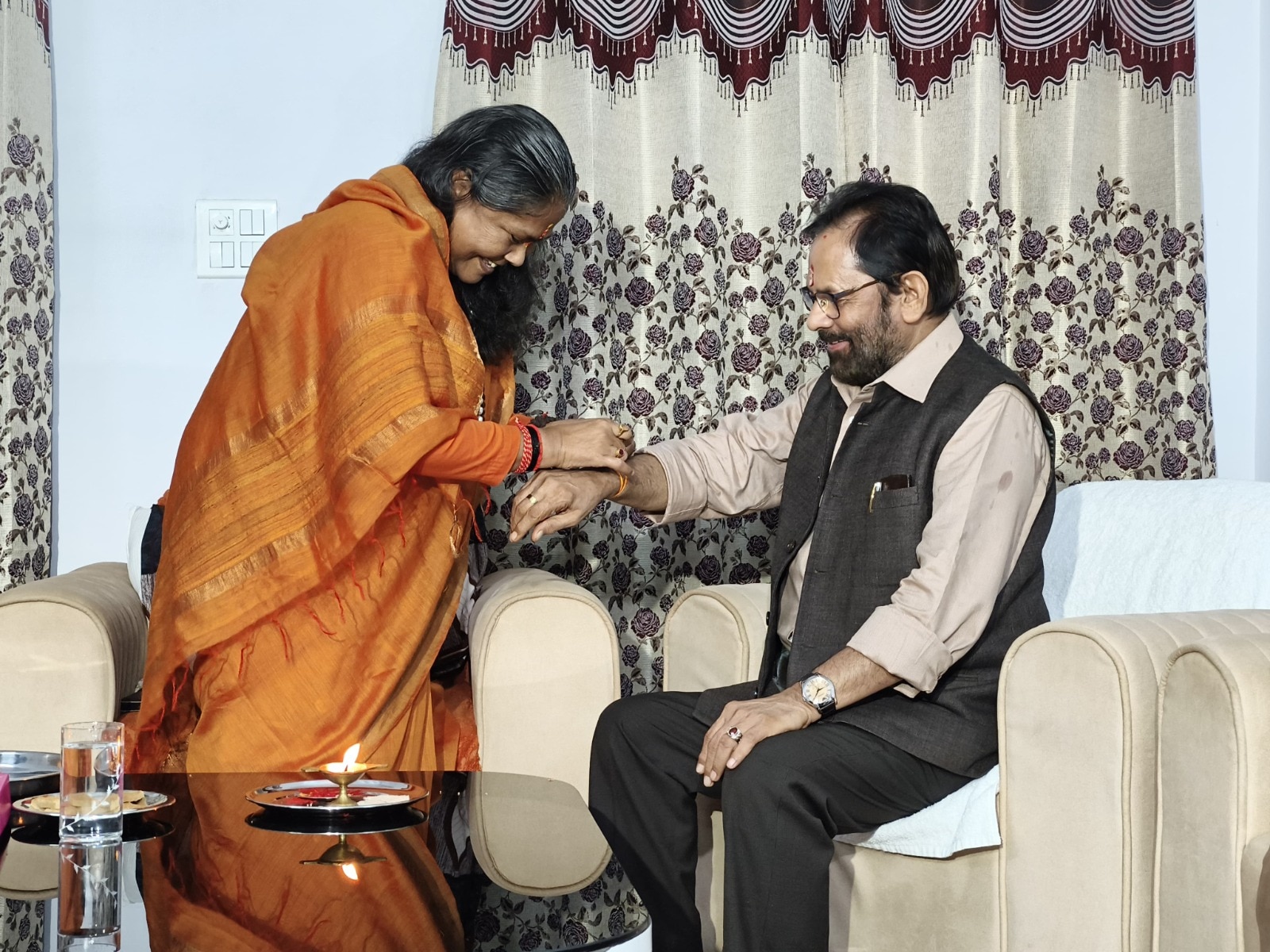 Sadhvi Niranjan Jyoti ties a Rakhi to Mukhtar Abbas Naqvi