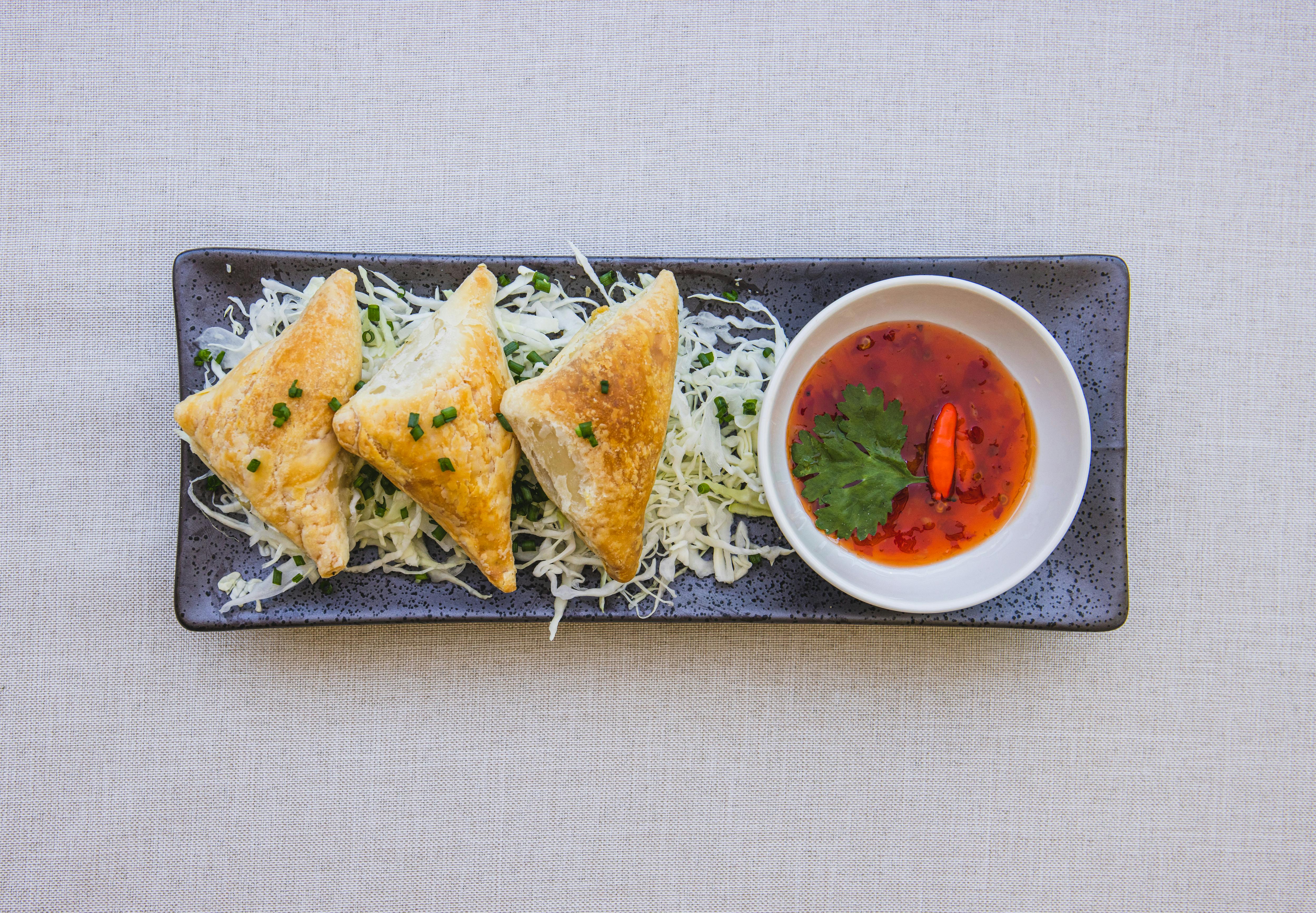 samosa and chutney in plate