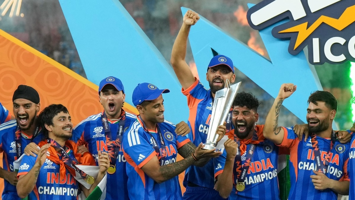  Suryakumar Yadav lifts the tournament trophy.
