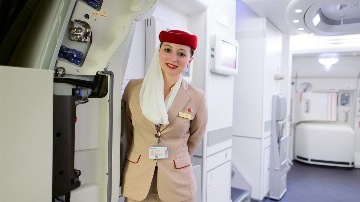 emirates-air-hostess-wear-red-hat-and-white-veil-uniform-storyemirates-air-hostess-wear-red-hat-and-white-veil-uniform-story