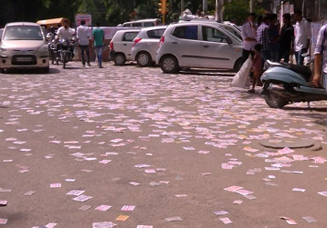 A view of DU campus with scattered pamphlets