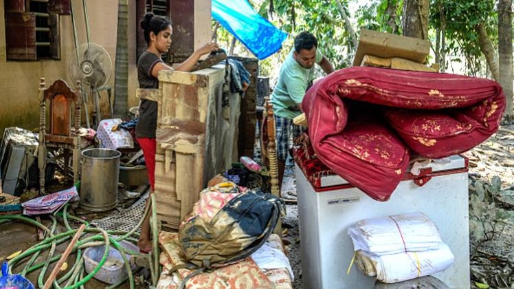 राहत शिविर से अपने घर लौटे लोग (फोटो-Getty Images)