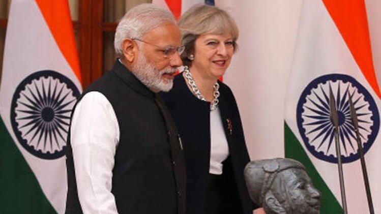 पीएम मोदी और ब्रिटेन की पीएम टेरीजा मे (प्रतीकात्मक फोटो: रायटर्स)