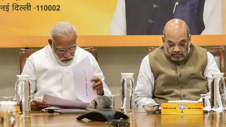 बैठक में मौजूद पीएम मोदी और अमित शाह (फोटो-PTI)