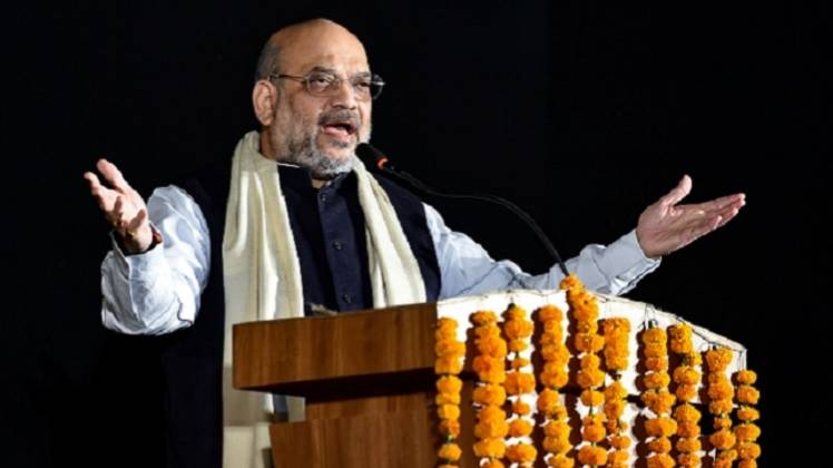 आदि महोत्सव के उद्घाटन समारोह को संबोधित करते भाजपा अध्यक्ष अमित शाह (PTI)