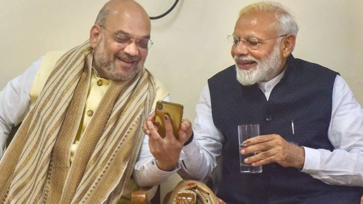 प्रधानमंत्री नरेंद्र मोदी के साथ गृहमंत्री अमित शाह (फाइल फोटो- PTI)