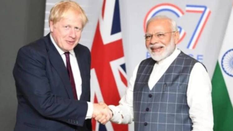 ब्रिटेन के प्रधानमंत्री बोरिस जॉनसन और पीएम मोदी (फाइल फोटो- PTI)