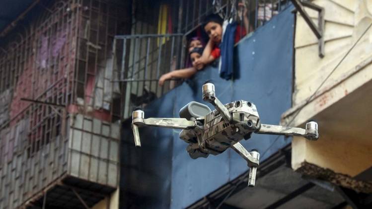 नरेला में ड्रोन के जरिए सैनिटाइजर का छिड़काव किया जा रहा है (फाइल फोटो-PTI)