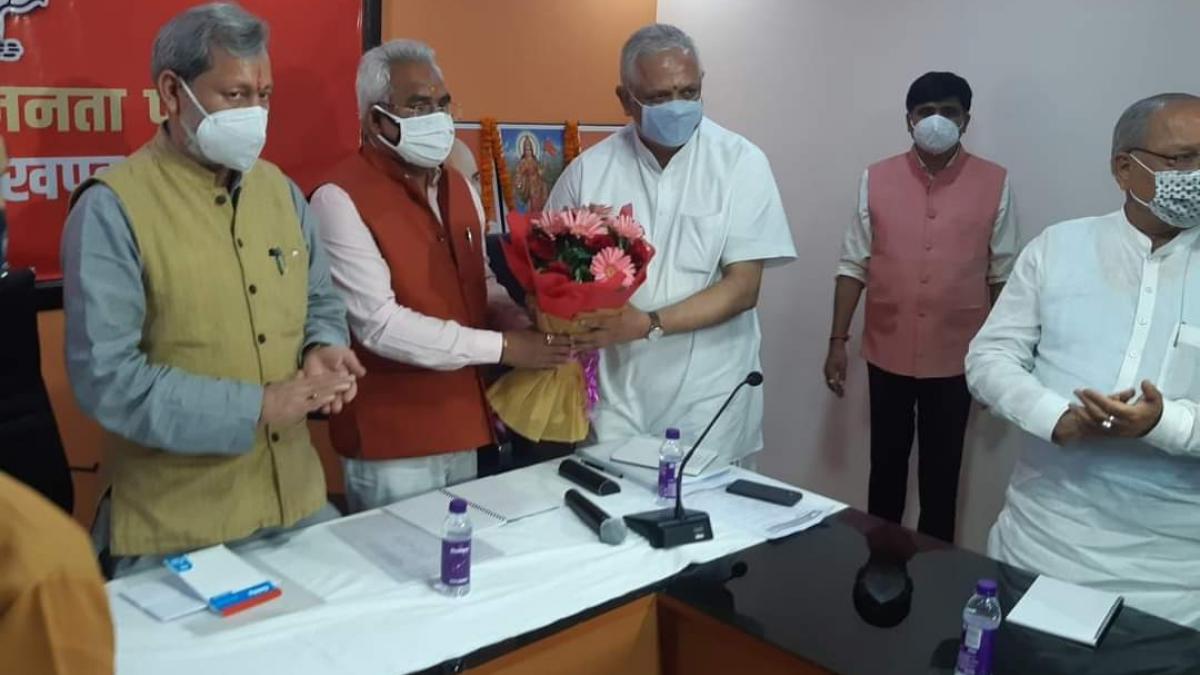 सीएम तीरथ सिंह रावत और बीएल संतोष