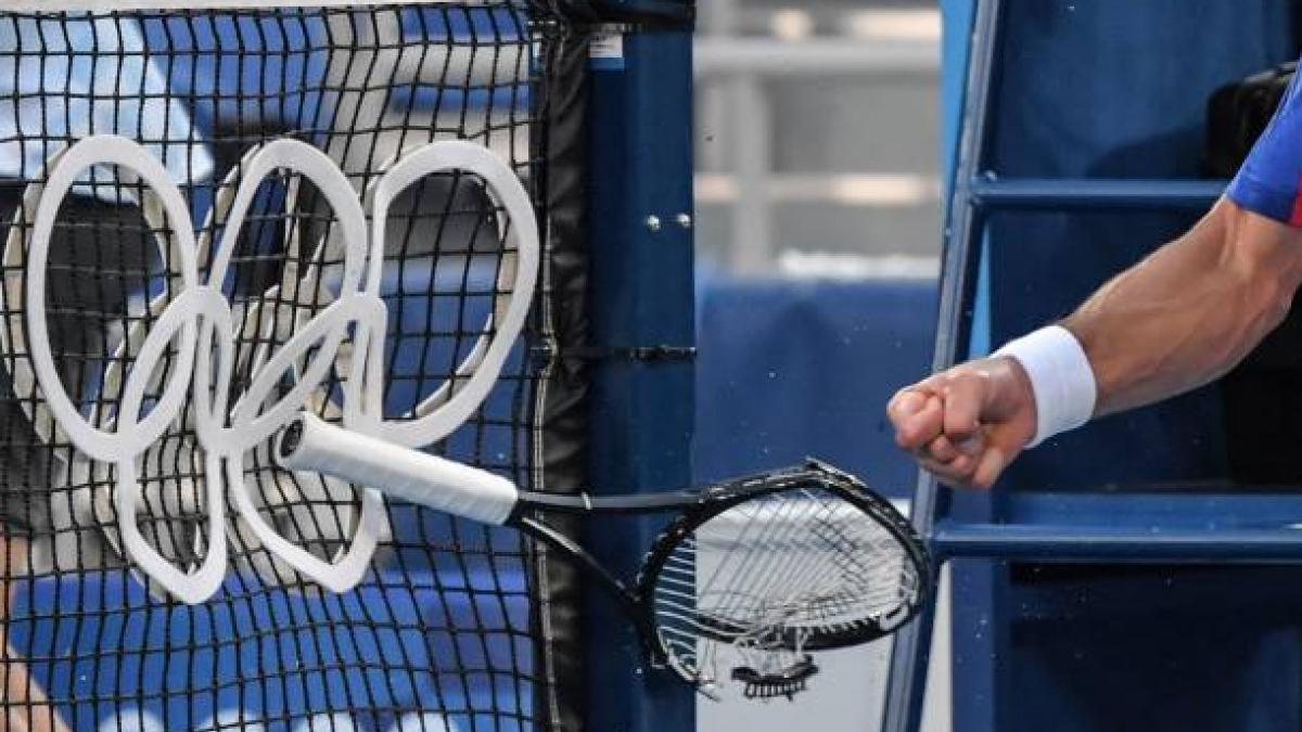 Serbia's Novak Djokovic smashes his racket during his Tokyo 2020 Olympic Games. (Getty)
