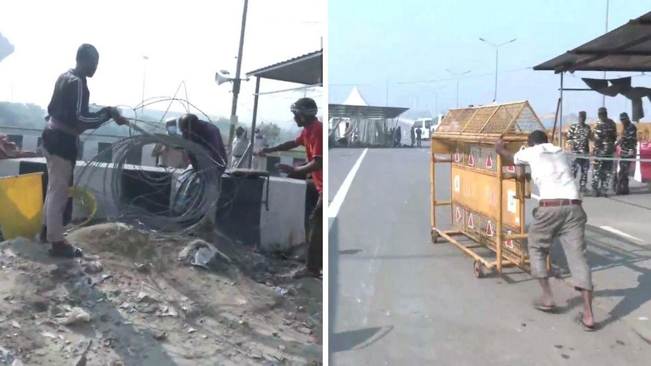 गाजीपुर बॉर्डर से बैरिकेड हटने शुरू (फोटो - ANI)