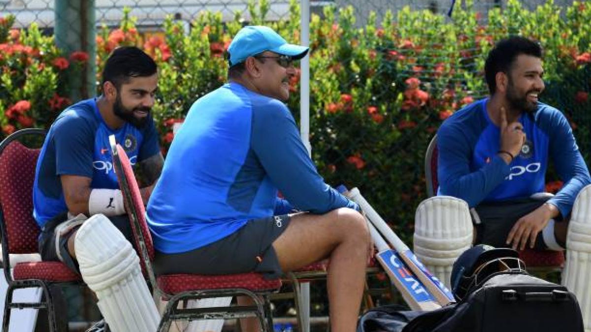 Virat Kohli (L), Rohit Sharma (R) and Ravi Shastri. (File, Getty)