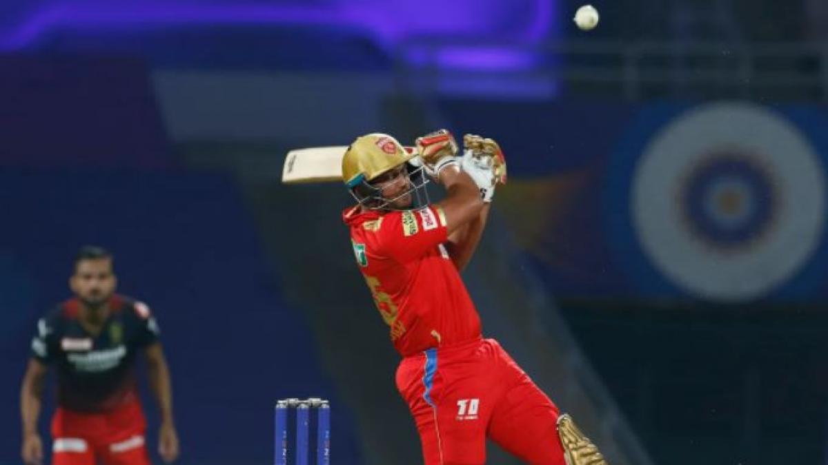 Shah Rukh Khan playing a shot during his inning (IPL)
