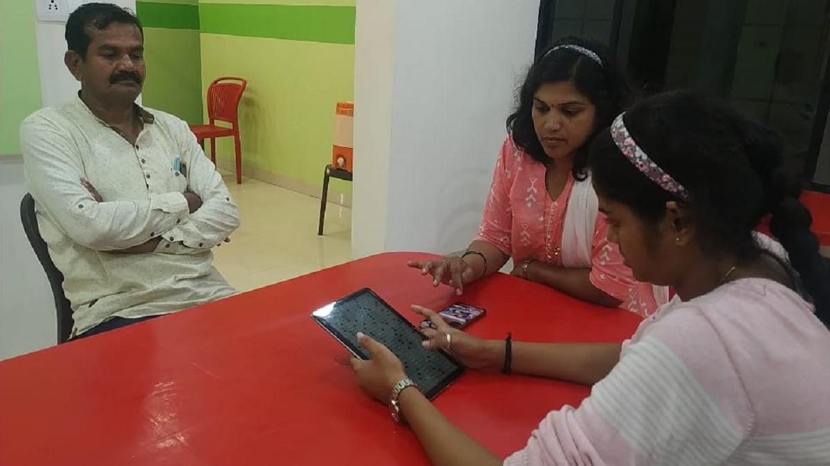 Devti More (with Tablet in Hand)