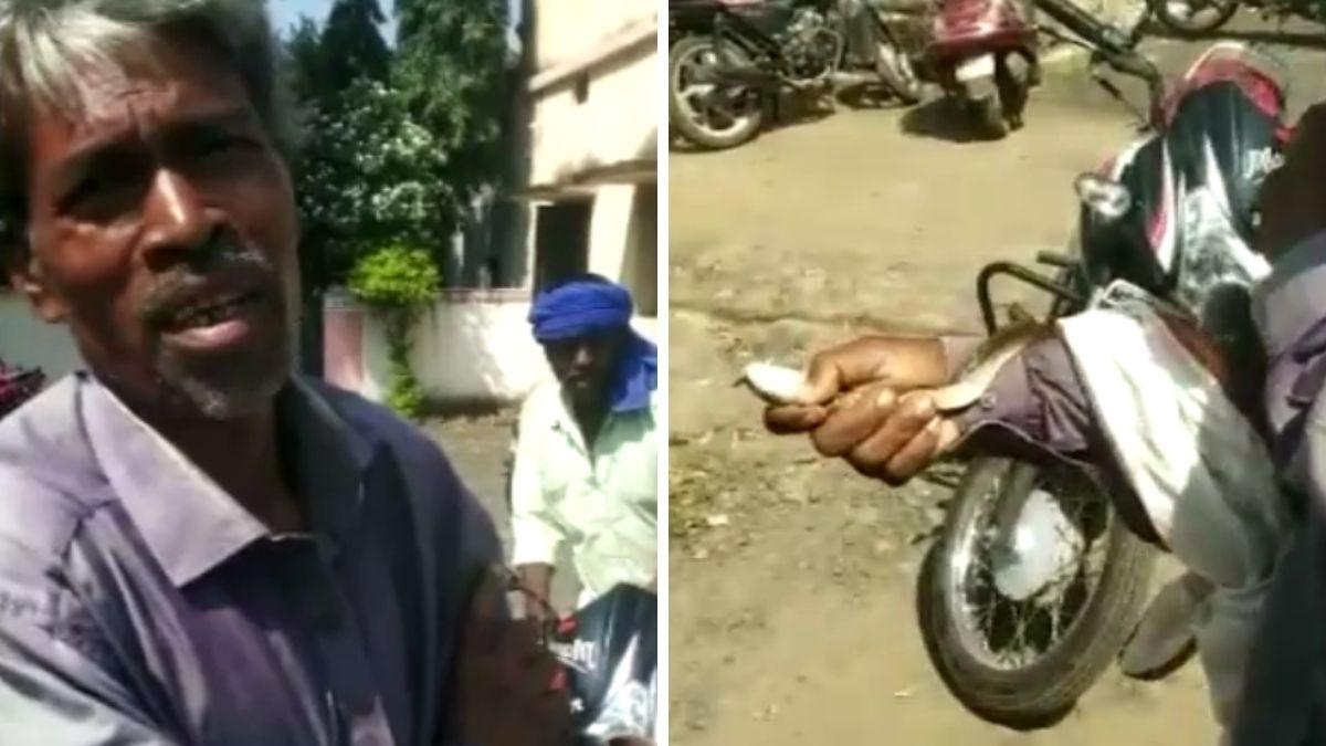 किसान के हाथ में लिपटा सांप. 