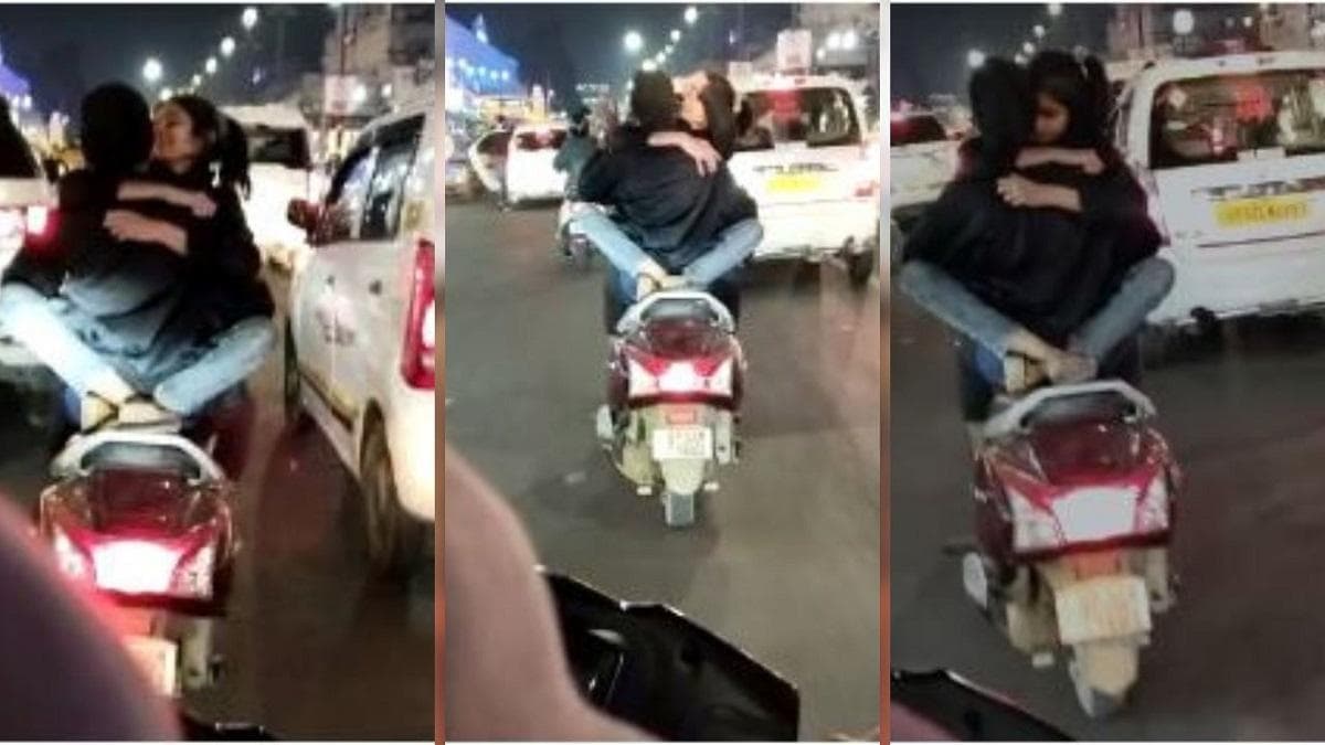 Lucknow: स्कूटी पर लड़के की गोद में बैठी लड़की, गले लगाकर किया Kiss, वीडियो  वायरल - lucknow hazratganj viral video Girl sitting on scooty in the boy  lap hugged and kiss lcla -
